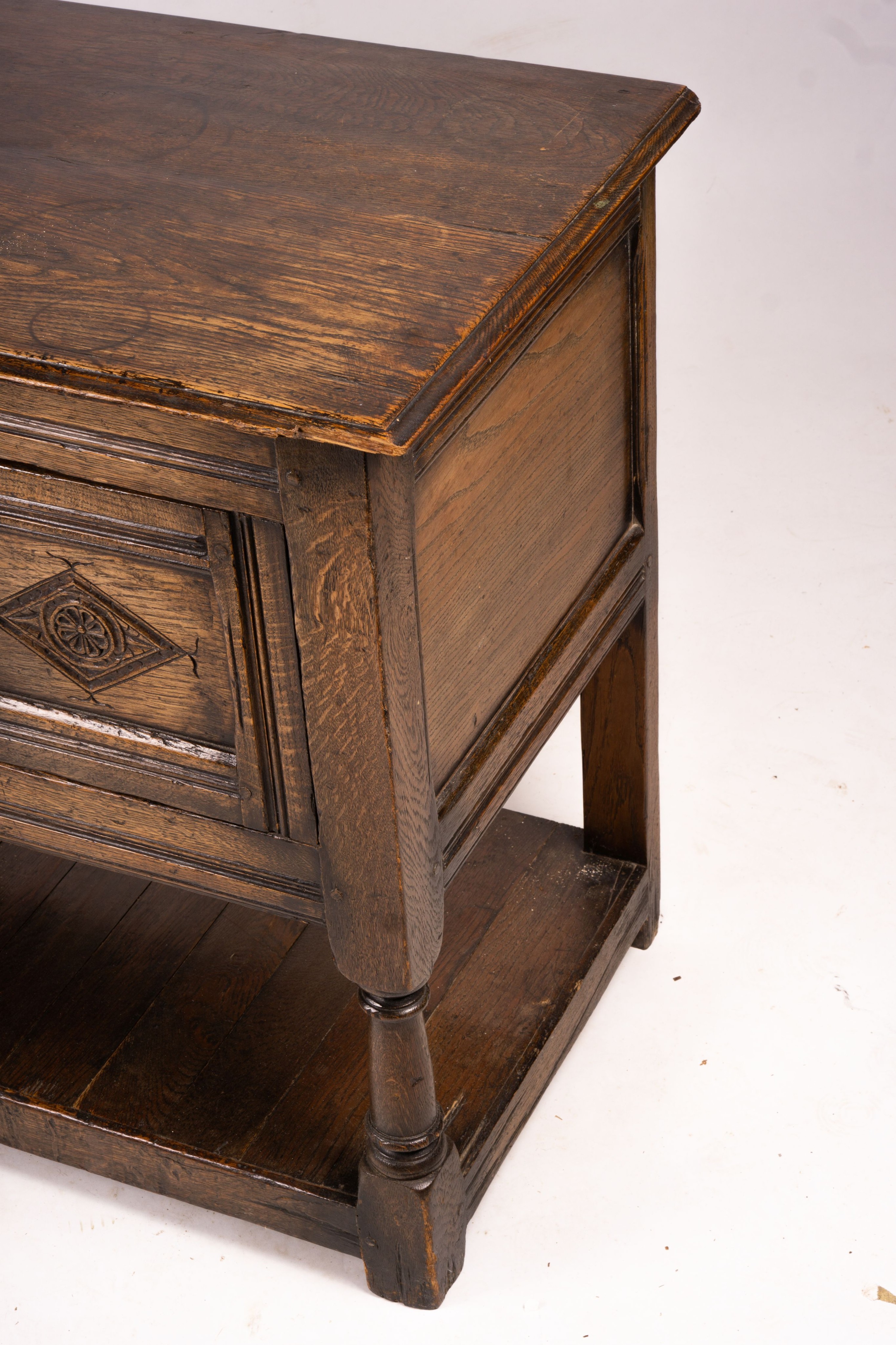 An 18th century style oak two door low cupboard, width 106cm, depth 50cm, height 78cm